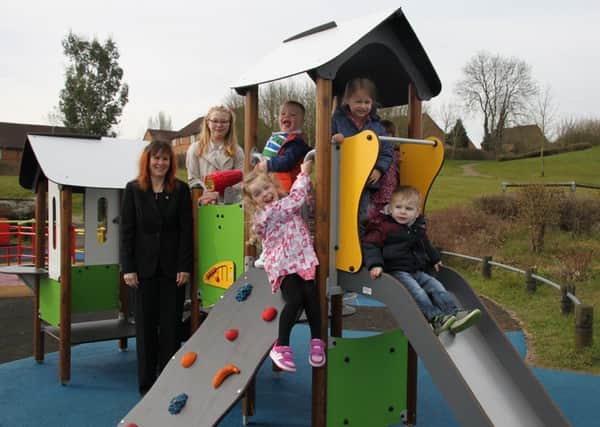 Trying out the new play equipment with DDCs Contracts and Performance Officer Julie Lewis are youngsters Caoimhe and Oisin Adams, Sofia Borhina, Abi Laidlaw and Elise and Ryley Becheley-Gordon.
