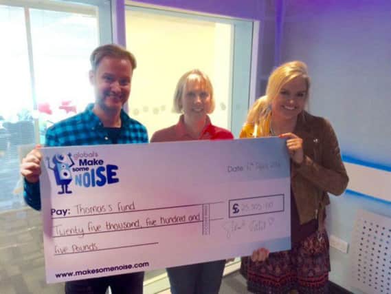 Heart Four Counties Breakfast Show presenters Stuart Miles and Katy Hill handed over a cheque for Â£25,000 to Thomas's Fund
