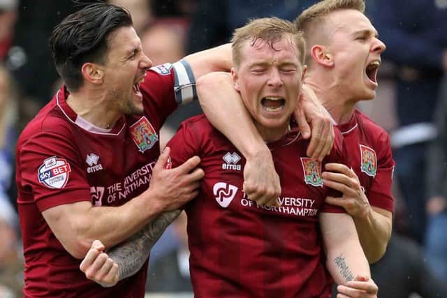 BIG AMBITION - Nicky Adams, pictured celebrating his goal last weekend with Dave Buchanan and Sam Hoskins, wants to reach the 100-points mark this season