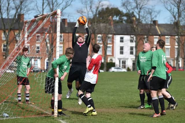 THAT'S MINE - action from Swan & Helmet's clash with Ashby Athletic (Pictures: Dave Ikin)