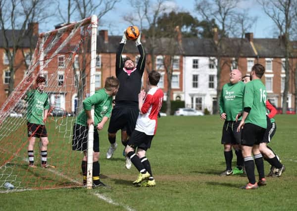 THAT'S MINE - action from Swan & Helmet's clash with Ashby Athletic (Pictures: Dave Ikin)
