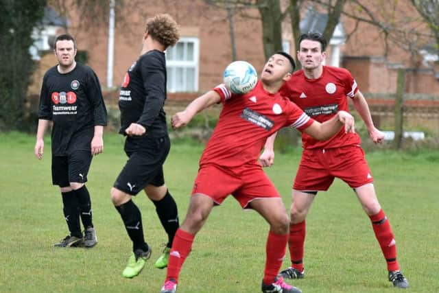 LOOK AT THE BALL! - action from Wootton St George's 5-0 defeat to Wellingborough Rising Sun (Pictures: Dave Ikin)