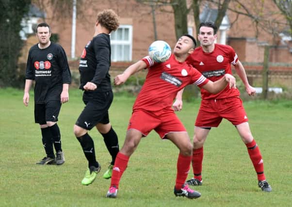 LOOK AT THE BALL! - action from Wootton St George's 5-0 defeat to Wellingborough Rising Sun (Pictures: Dave Ikin)