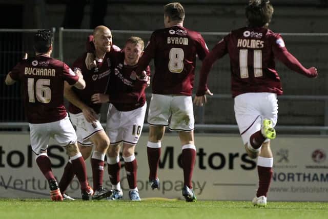 PLENTY OF QUALITY - Jason Taylor, pictured celebrating his goal in the FA Cup win over Northwich in December, believes the Cobblers squad is already well prepared for life in league one next season