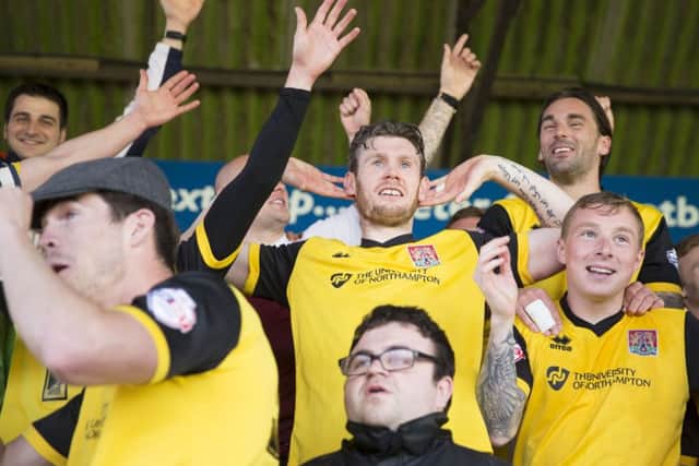 CHAMPIONS! - the Cobblers players celebrate their title success at Exeter (Pictures: Kirsty Edmonds)