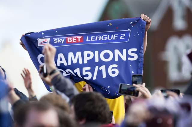 CHAMPIONS: Cobblers will lift the League Two title in their final home game against Luton after confirming themselves as champions at Exeter on Saturday (pictures by Kirsty Edmonds)