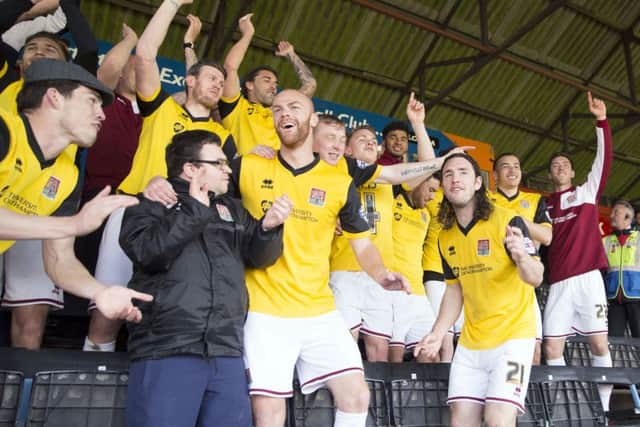 CELEBRATIONS! - the Cobblers sealed the league two title at Exeter on Saturday