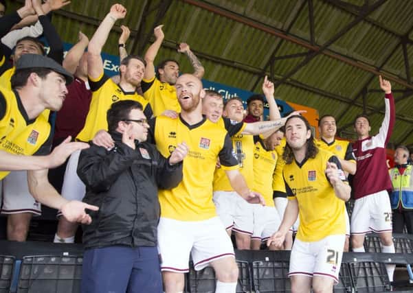 CELEBRATIONS! - the Cobblers sealed the league two title at Exeter on Saturday