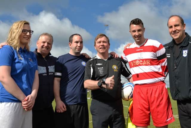 Captains Lee Thomas and Adam Green with James Burton's partner Jaydean Neal before the game