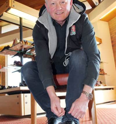 Northampton Town Football Club Manager Chris Wildervisiting Barker Shoes in Earls Barton to receive a pair of handmade shoes for taking the Cobblers into League 1 Picture: Steven Prouse