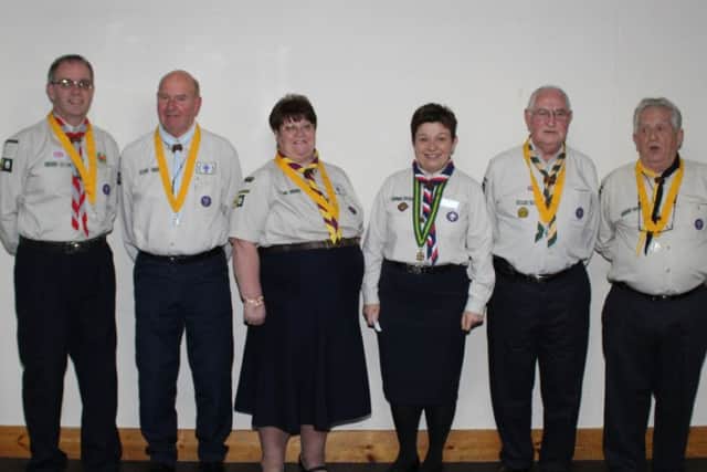 The Scout leaders receive their awards