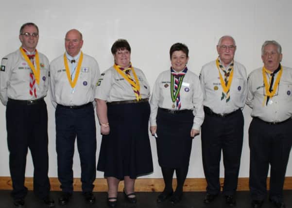 The Scout leaders receive their awards