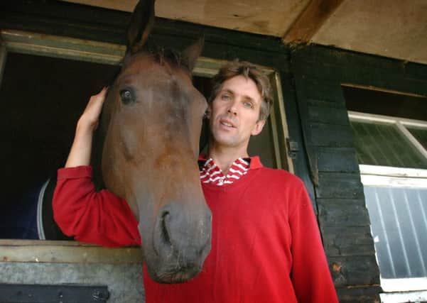 Alex Hales, pictured here with Salut Honore, is happy to have secured a rare win at Cheltenham