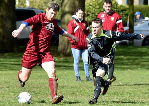 Action from the clash between Abington and AFC Thorpe (Pictures: Dave Ikin)
