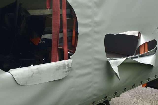 Thieves cut the side curtain of the lorry to steal the games.