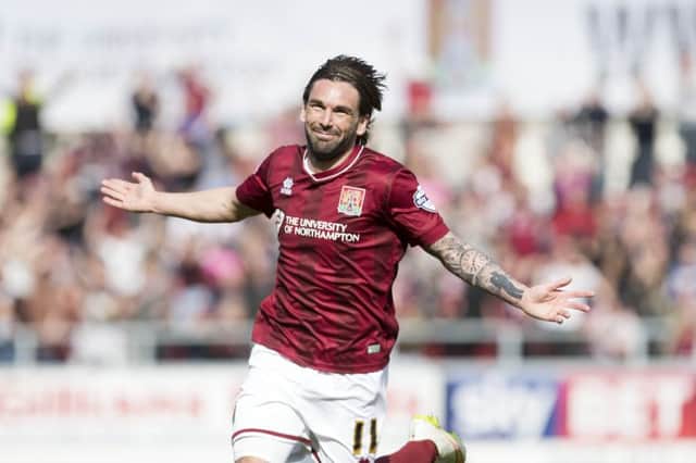 GOING NOWHERE - Ricky Holmes has told Cobblers supporters not to worry regarding speculation about his future
