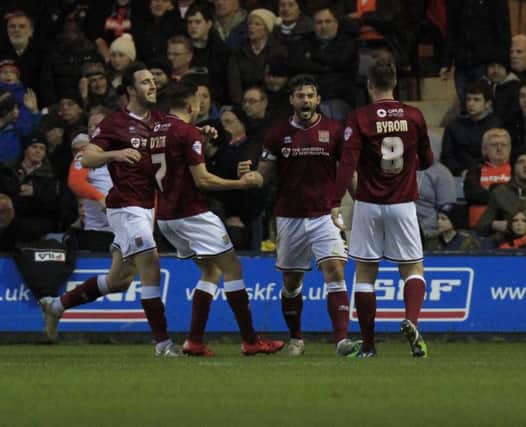 Marc Richards celebrates after scoring Northampton's third goal at Kenilworth Road. Pictures by Liam Smith