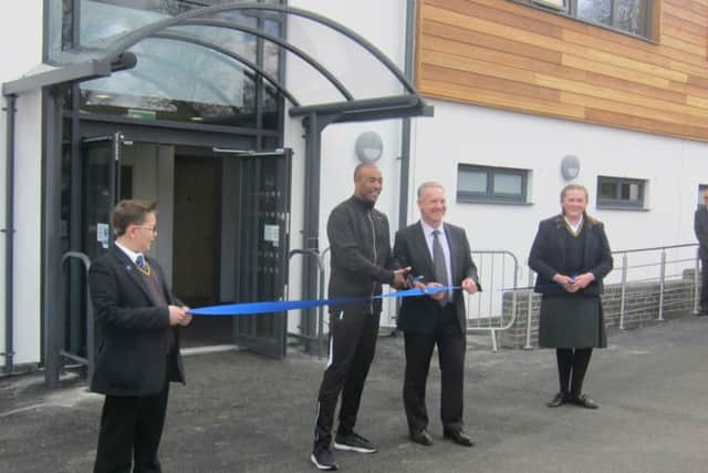 Colin Jackson has officially opened a new Â£2 million sports centre at Pitsford School