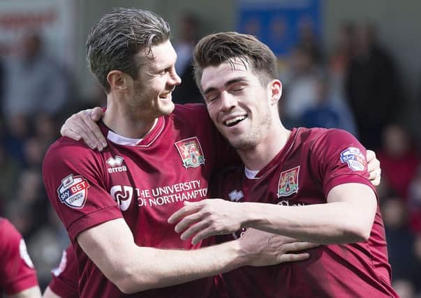 GOAL STARS - Zander Diamond congratulates John Marquis on scoring the Cobblers' second goal in the 2-0 win over Luton Town (Pictures: Kirsty Edmonds)