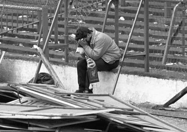 File photo dated 15/04/1989 of a Liverpool fan at Hillsborough after their FA Cup semi-final football match against Nottingham Forest. The families of 96 people killed in the Hillsborough tragedy will see thousands of official documents relating to the disaster for the first time today. PRESS ASSOCIATION Photo. Issue date: Wednesday September 12, 2012. The Hillsborough Independent Panel has been overseeing the release of previously unpublished papers from around 80 organisations including the Government, police, emergency services, Sheffield City Council and the South Yorkshire coroner. See PA story INQUIRY Hillsborough. Photo credit should read: John Giles/PA Wire ENGEMN00220120913135346