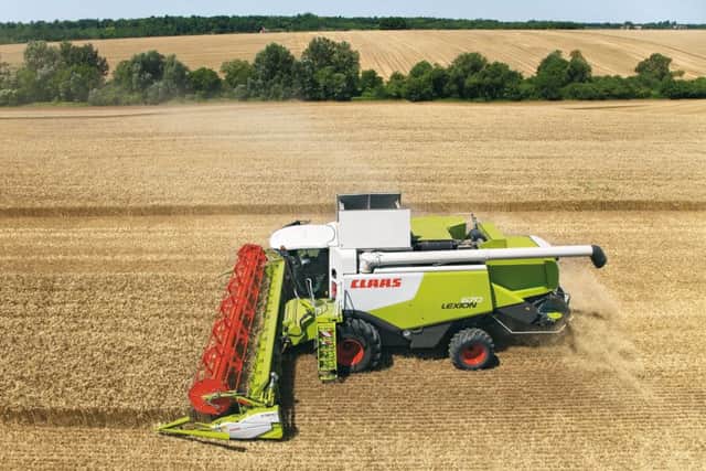 A UK farmer bringing in the harvest