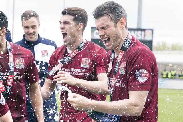 PARTY TIME! - Zander Diamonds enjoys the post-match celebrations at Sixfields on Saturday (Pictures: Kirsty Edmonds)
