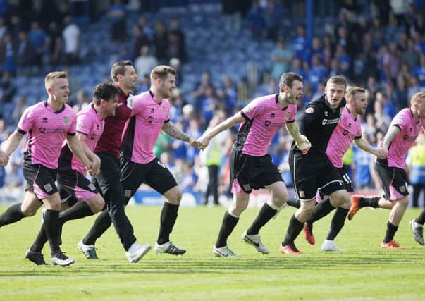 PARTY TIME! - the Cobblers players celebrate after their 2-1 win at Portsmouth on Saturday (Pictures: Kirsty Edmonds)