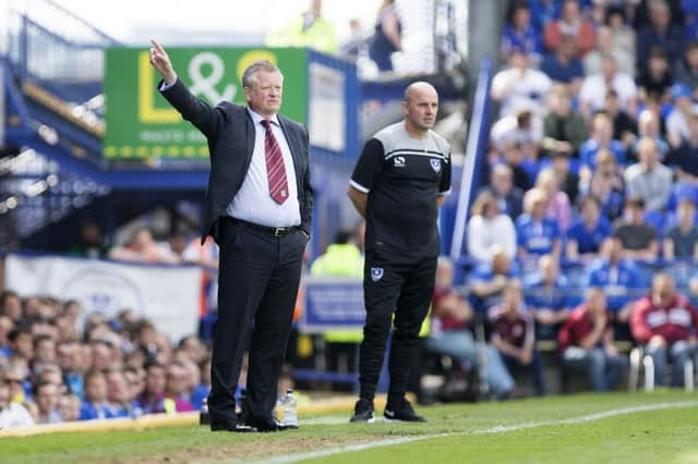 Chris Wilder and counterpart Paul Cook on the touchline at Fratton Park. Pictures: Kirsty Edmonds