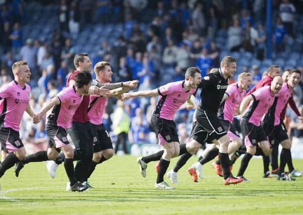GOOD THING GOING - the Cobblers squad celebrate ending their record-breaking season with a win at Portsmouth