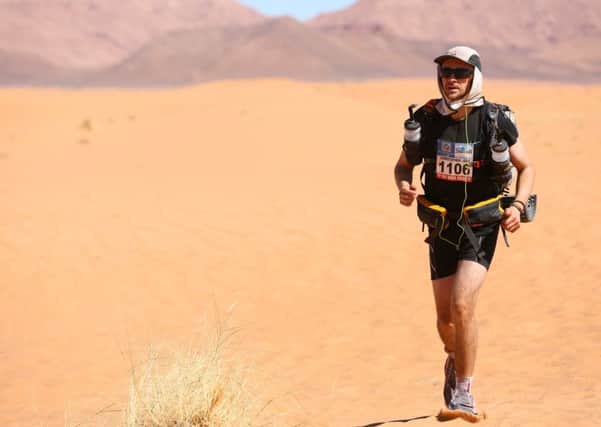 Chris Patterson running through the Sahara during the Marathon des Sables.