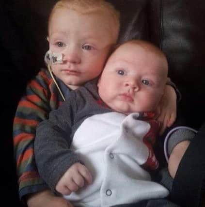 Luke and his brother during treatment