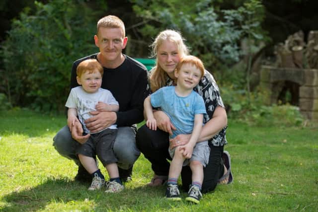 Luke Ross, right, with brother Euan, dad Tim and mum Jess
