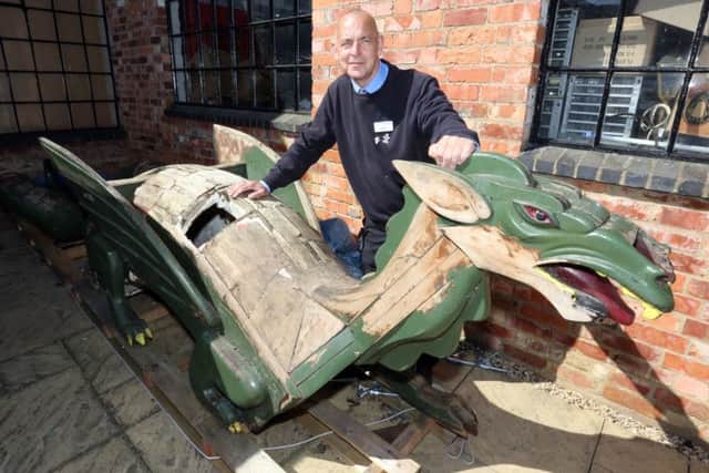 Dan Hurn from Wellingborough Museum with Arnie the dragon