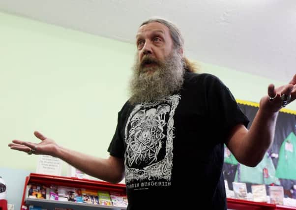 Alan Moore reading one of his stories in St Jame's Library in 2014 NNL-141017-154105001