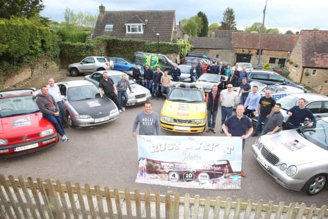 Rust Buckets: Cranford: Pre-meet of the Rust Bucket Rally, people driving 2,500 miles across Europe in old banger cars to raise money for Down's Syndrome charity - Ups and Downs
Tuesday May 17 2016 NNL-160517-201851009