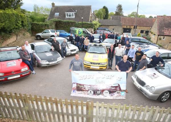 Rust Buckets: Cranford: Pre-meet of the Rust Bucket Rally, people driving 2,500 miles across Europe in old banger cars to raise money for Down's Syndrome charity  - Ups and Downs

Tuesday May 17 2016 NNL-160517-201851009