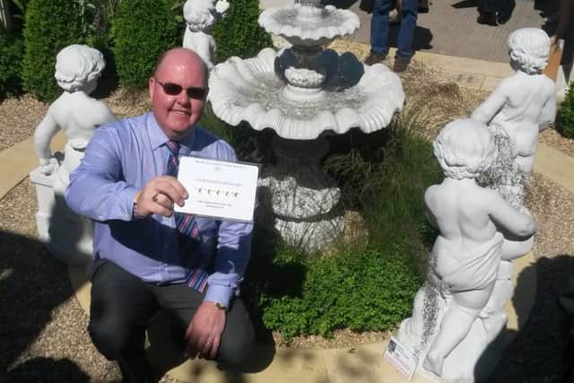 Simon Scott, Haddonstone marketing director and designer, with the award at Chelsea
