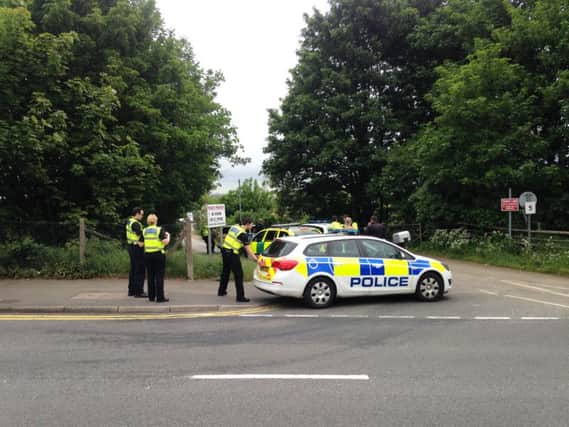 Police dealing with the incident in Spencer Bridge Road, Northampton NNL-160526-121925001