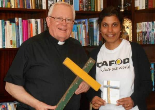 Lampedusa Cross was presented to Bishop Peter Doyle by CAFOD Northampton representative Deborah Purfield