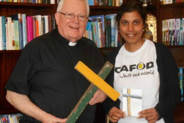 Lampedusa Cross was presented to Bishop Peter Doyle by CAFOD Northampton representative Deborah Purfield