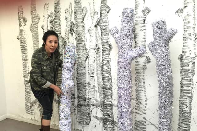 Annie Zaneboni with her work