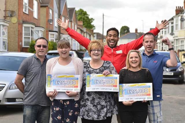 People's Postcode Lottery winners Michelle Parry, Liz Kennelly and Heidi Barham from Wellingborough with lottery ambassador Danyl Johnson