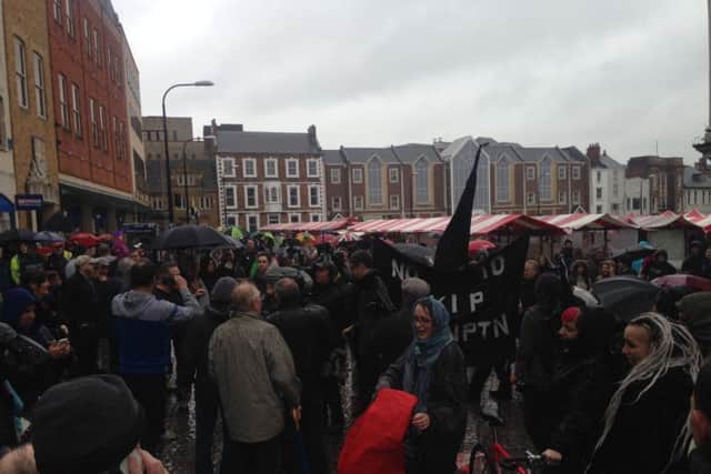 A Market Place protest put paid to Nigel Farage's hopes of addressing Northampton from atop a purple battlebus today.