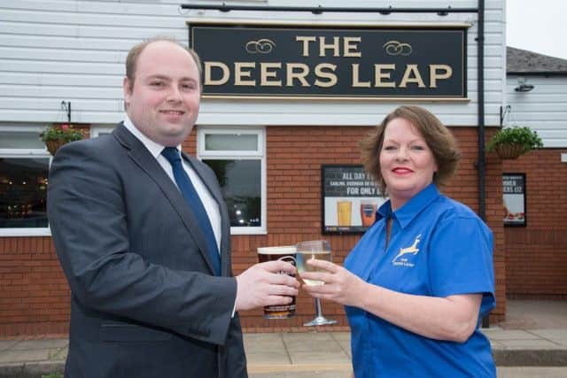 Northampton South MP David Mackintosh and Publican Teresa Rolfe toast the Deers Leap re-opening