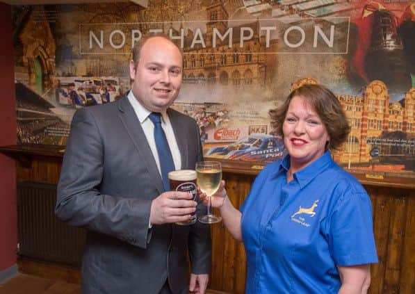 Northampton South MP David Mackintosh and Publican Teresa Rolfe toast the Deers Leap re-opening