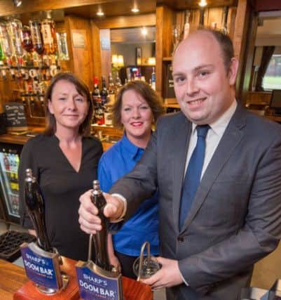 Northampton South MP David Mackintosh and Publican Teresa Rolfe toast the Deers Leap re-opening
