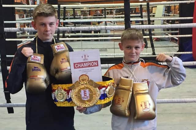Oliver James (right) joined elder brother Eithan in becoming a national champion