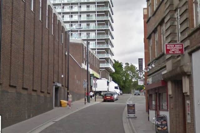 A woman was pulled from her mobility scooter in Wellington Street.
