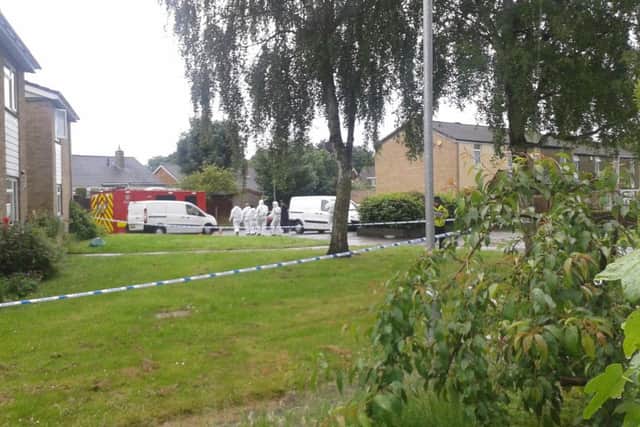 Forensic officers at the scene in Patterdale Walk, Boothville NNL-160614-163302001