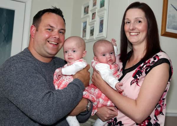Father's Day: Rothwell: First fathers day with IVF twins Amie and Evie, born on Christmas Day 3 months premature. Dad Marc Owen, 38, with twins Amie and Evie, and mum Cheryl Hutchins, 33. 

Tuesday June 14, 2016 NNL-160614-195050009